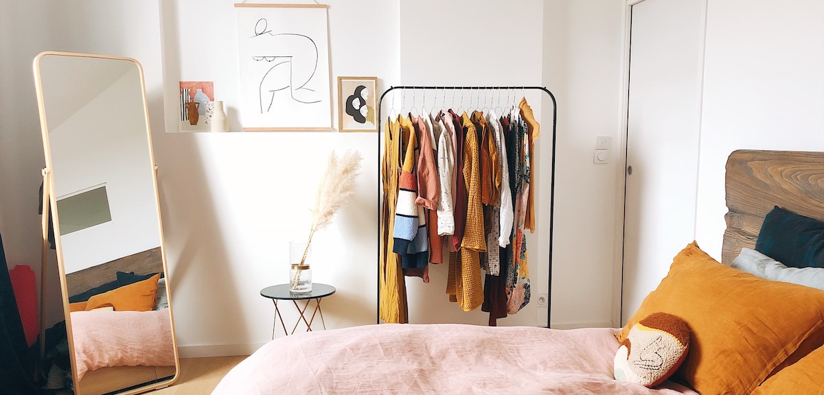 Try using clothes racks to organize your wardrobe!